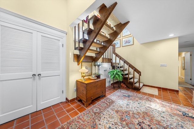 stairs featuring tile patterned floors