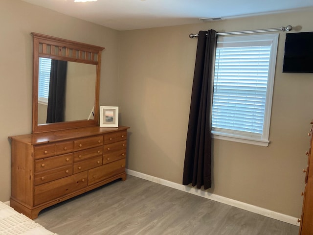 bedroom featuring wood-type flooring