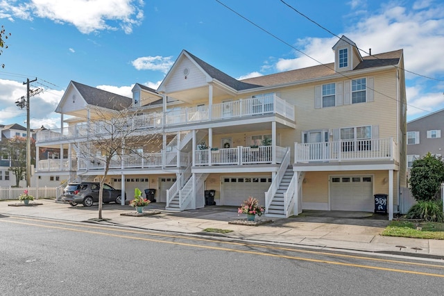 view of front of house with covered porch and a garage