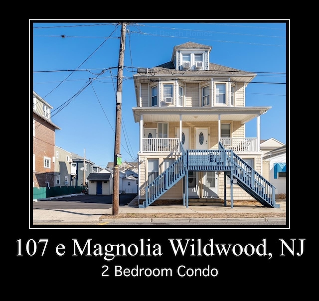 view of front of property with a porch and stairway