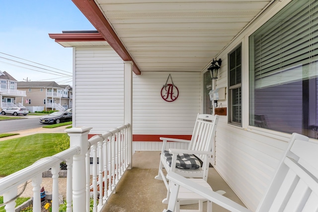view of patio / terrace featuring a porch and a residential view