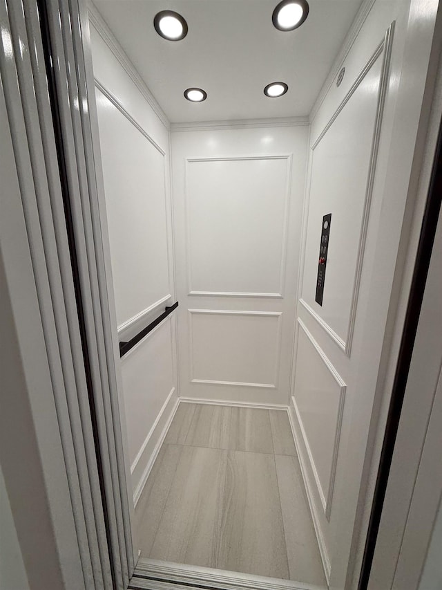207 120th St, Stone Harbor, NJ 08247 - elevator with a decorative wall and recessed lighting