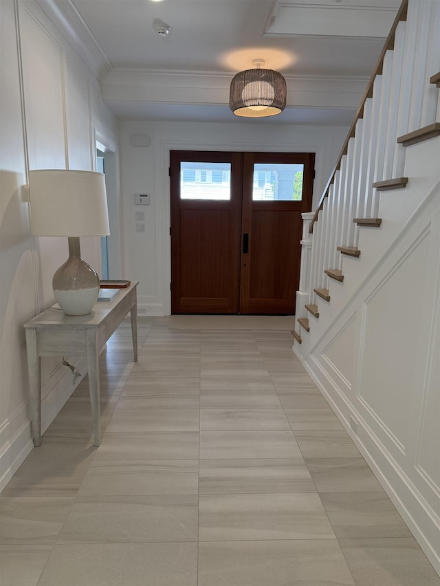 207 120th St, Stone Harbor, NJ 08247 - entryway featuring crown molding, stairway, and light tile patterned floors