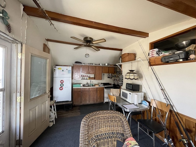 kitchen with vaulted ceiling with beams, ceiling fan, sink, and white appliances