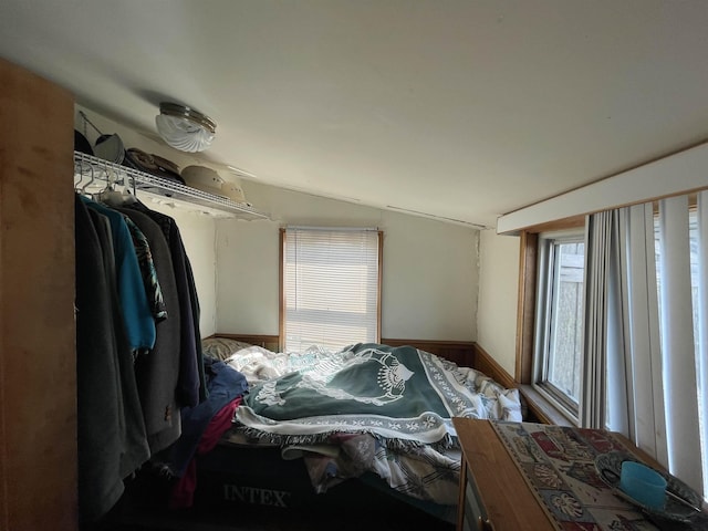 bedroom with lofted ceiling