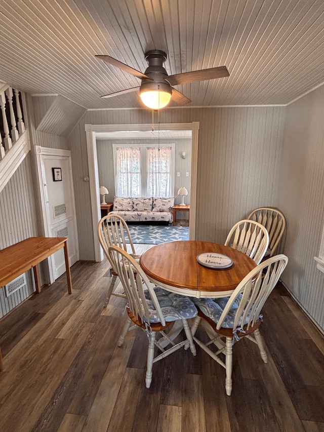 dining area featuring wooden ceiling, a ceiling fan, and wood-type flooring