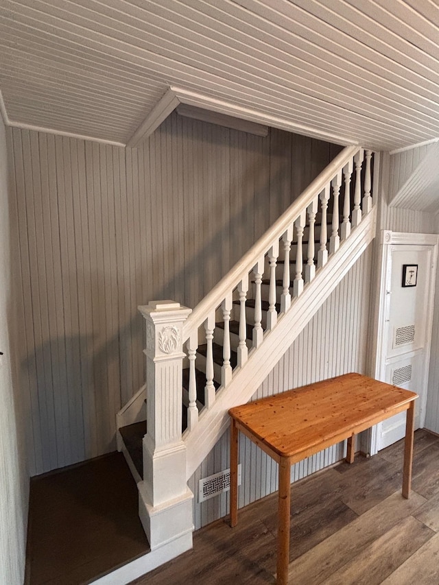 stairs with wood finished floors