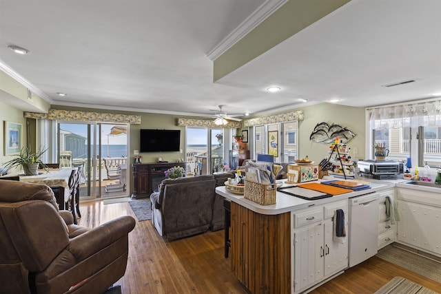 127 W Spruce Ave Unit B, North Wildwood, NJ 08260 - kitchen with open floor plan, dishwasher, white cabinets, light countertops, and ornamental molding