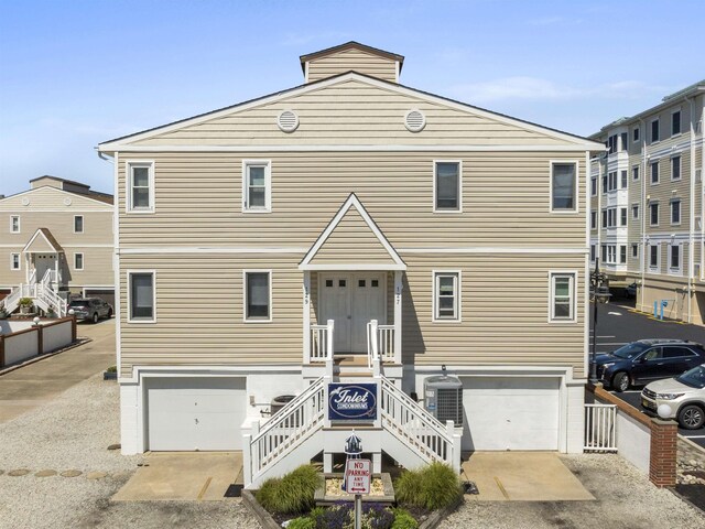 127 W Spruce Ave Unit B, North Wildwood, NJ 08260 - coastal home with a garage, stairs, and central air condition unit