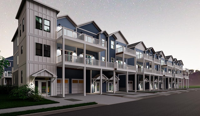 view of building exterior featuring an attached garage and a residential view