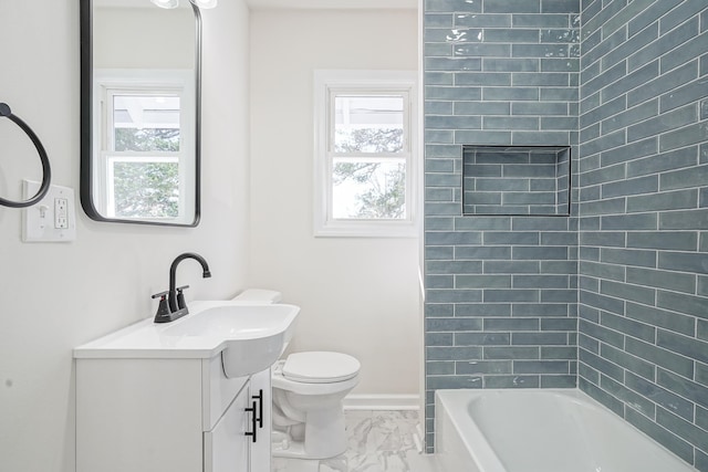 full bath with toilet, marble finish floor, plenty of natural light, and vanity