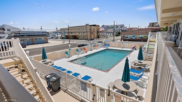 view of swimming pool featuring a patio