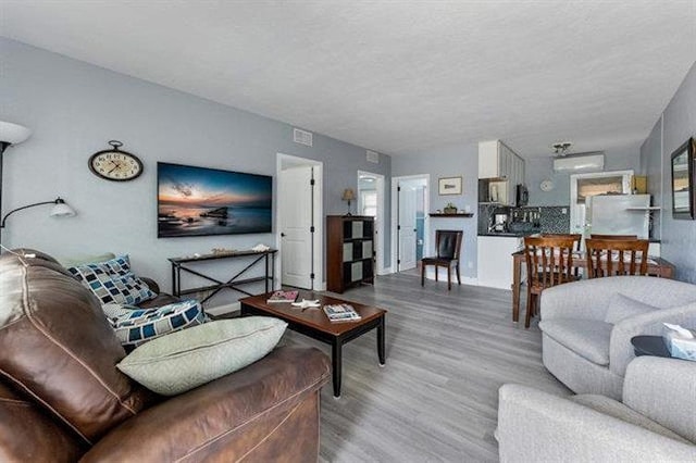 301 E Lavender Rd Unit 2, Wildwood, NJ 08260 - living room featuring wood finished floors and a textured ceiling