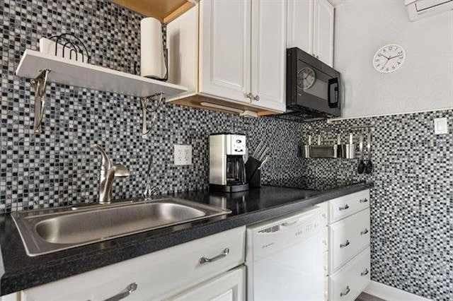 301 E Lavender Rd Unit 2, Wildwood, NJ 08260 - kitchen featuring black microwave, white dishwasher, open shelves, a wall mounted air conditioner, and white cabinetry