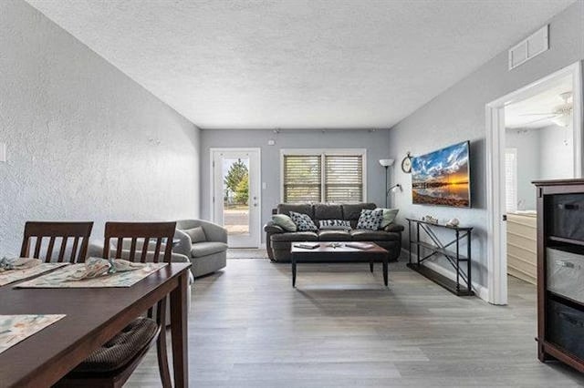 301 E Lavender Rd Unit 2, Wildwood, NJ 08260 - living area featuring wood finished floors, a textured ceiling, and a textured wall