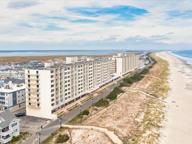 bird's eye view featuring a beach view and a water view