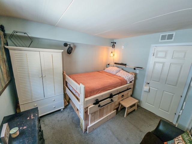 carpeted bedroom featuring visible vents