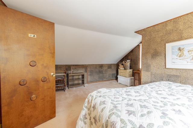 bedroom with lofted ceiling and carpet