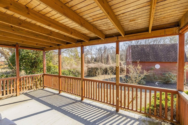 wooden deck with an outbuilding