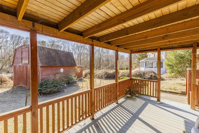 deck with an outbuilding and a shed