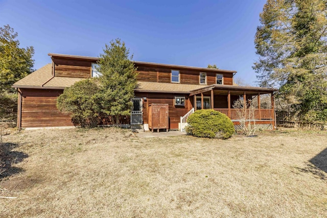 view of front of house featuring a shingled roof