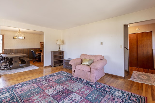 living room featuring baseboards and wood-type flooring