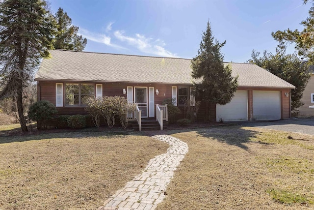 single story home with gravel driveway, a front lawn, a garage, and roof with shingles