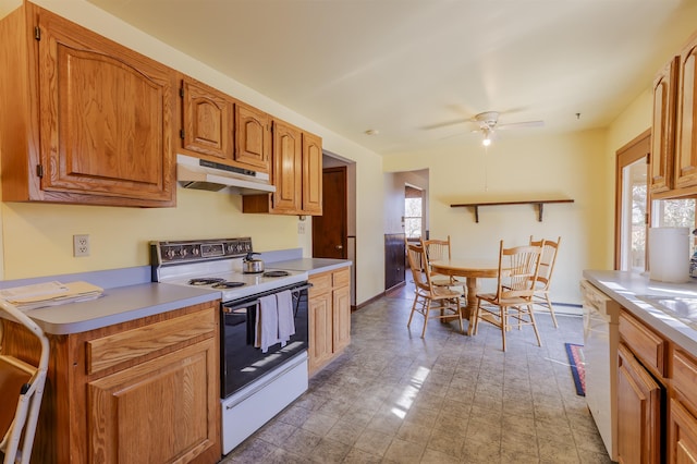 kitchen featuring under cabinet range hood, white appliances, light countertops, baseboards, and ceiling fan