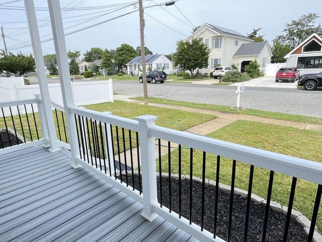 712 Indian Ave, North Cape May, NJ 08204 - wooden porch featuring a residential view and a yard