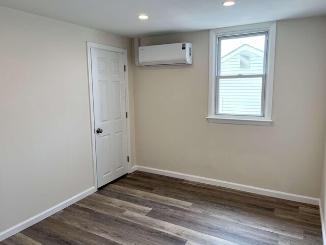 712 Indian Ave, North Cape May, NJ 08204 - spare room with an AC wall unit, recessed lighting, and dark wood-type flooring