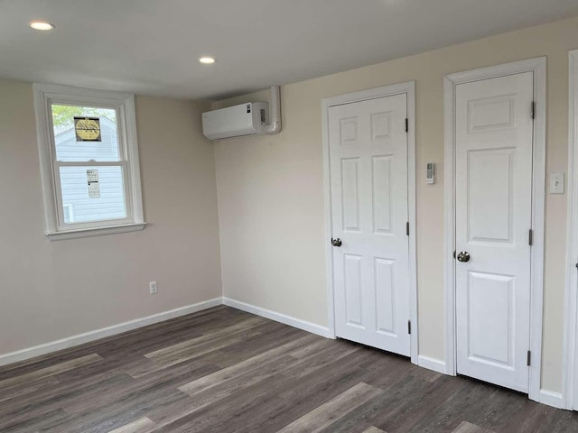 712 Indian Ave, North Cape May, NJ 08204 - below grade area with a wall unit AC, dark wood-style floors, and recessed lighting