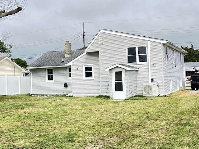 712 Indian Ave, North Cape May, NJ 08204 - back of house with a chimney and a shingled roof