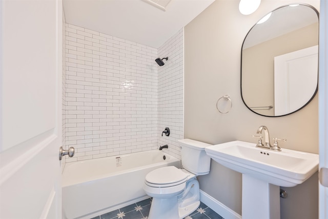 full bathroom with tile patterned floors, sink, toilet, and tiled shower / bath