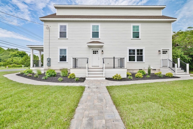 view of front of home with a front lawn