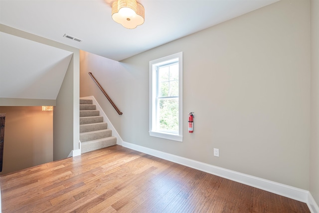 spare room with hardwood / wood-style flooring