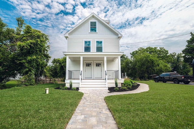 view of front of property featuring a porch and a front lawn