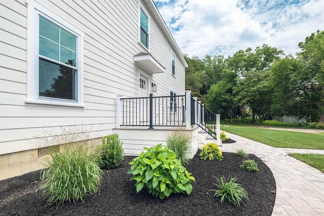 view of property exterior featuring a yard