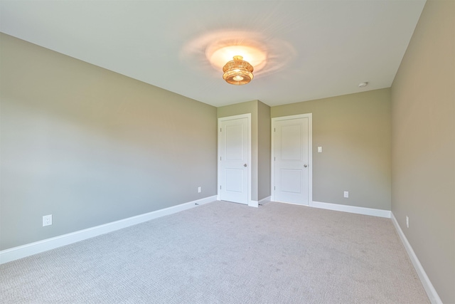 unfurnished bedroom with light carpet