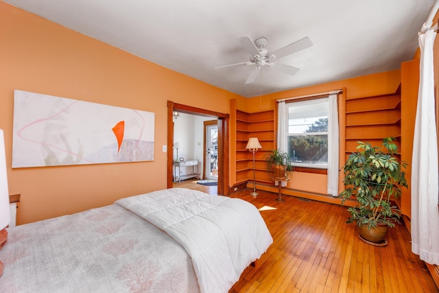 bedroom featuring hardwood / wood-style flooring and ceiling fan