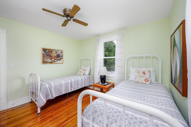 bedroom featuring ceiling fan and hardwood / wood-style floors