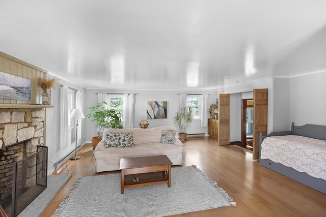 1101 New York Ave, Cape May, NJ 08204 - living area with wood finished floors, baseboard heating, and a fireplace
