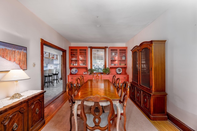 dining area with light wood-type flooring