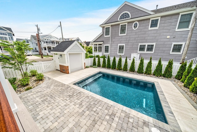188 34th St, Avalon, NJ 08202 - view of pool featuring a patio area, a fenced backyard, an outdoor structure, and a gate