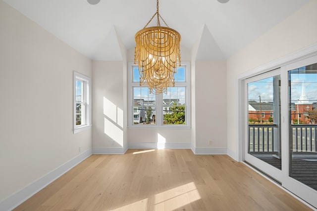 188 34th St, Avalon, NJ 08202 - unfurnished dining area with a chandelier, light wood-type flooring, healthy amount of natural light, and vaulted ceiling