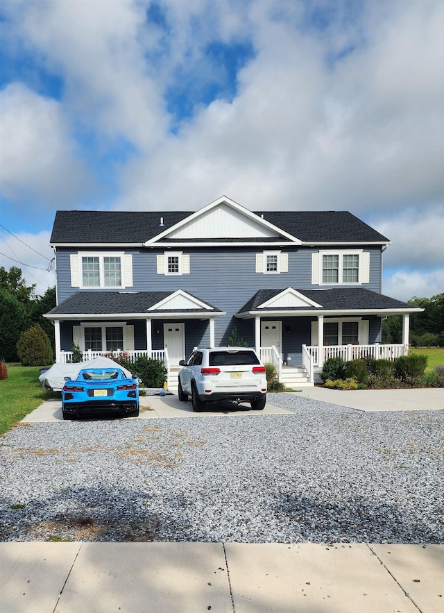 farmhouse-style home featuring covered porch