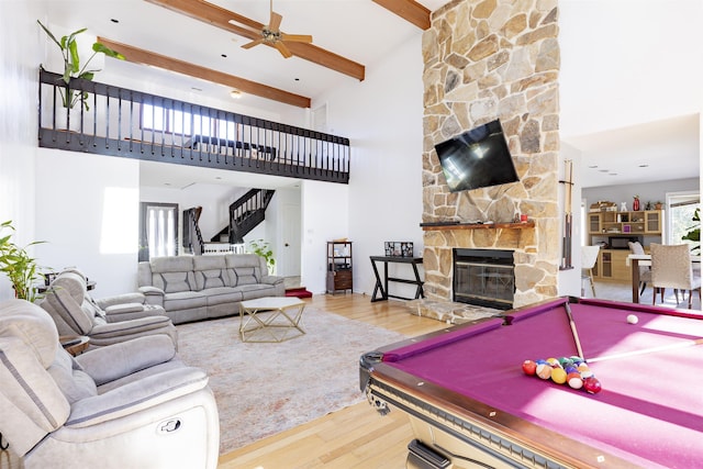 6 Rabbit Run, North Cape May, NJ 08204 - rec room featuring wood finished floors, a towering ceiling, a fireplace, beamed ceiling, and a ceiling fan