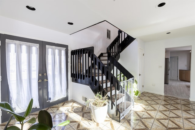 6 Rabbit Run, North Cape May, NJ 08204 - foyer featuring baseboards, stairway, french doors, and visible vents