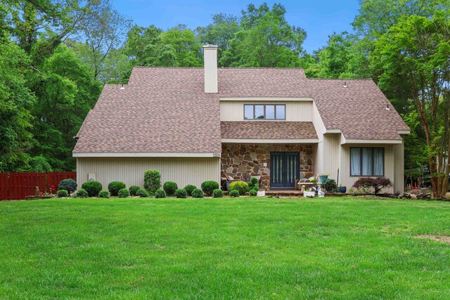 6 Rabbit Run, North Cape May, NJ 08204 - view of side of home with a garage, fence, a chimney, a shingled roof, and driveway