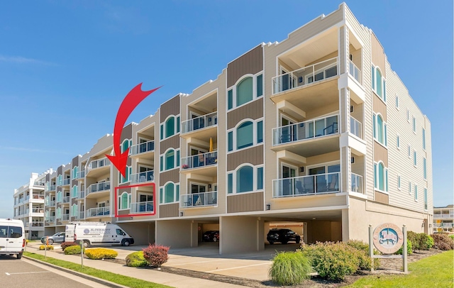 415 E Heather Rd Unit 105, Wildwood Crest, NJ 08260 - view of apartment building / complex featuring covered and uncovered parking