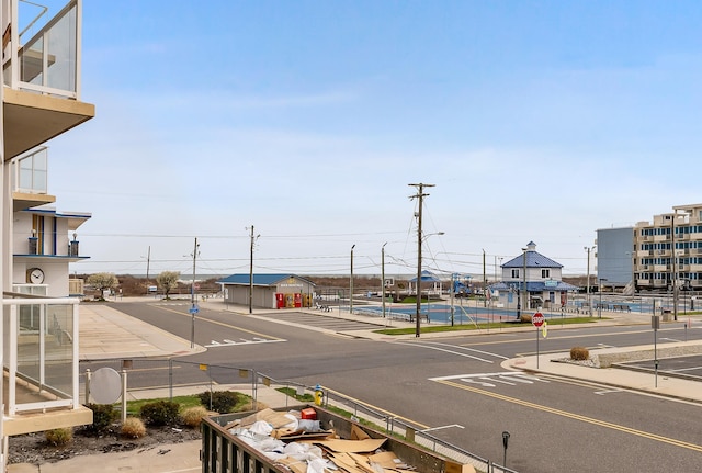 415 E Heather Rd Unit 105, Wildwood Crest, NJ 08260 - view of asphalt street featuring traffic signs, sidewalks, curbs, and street lighting